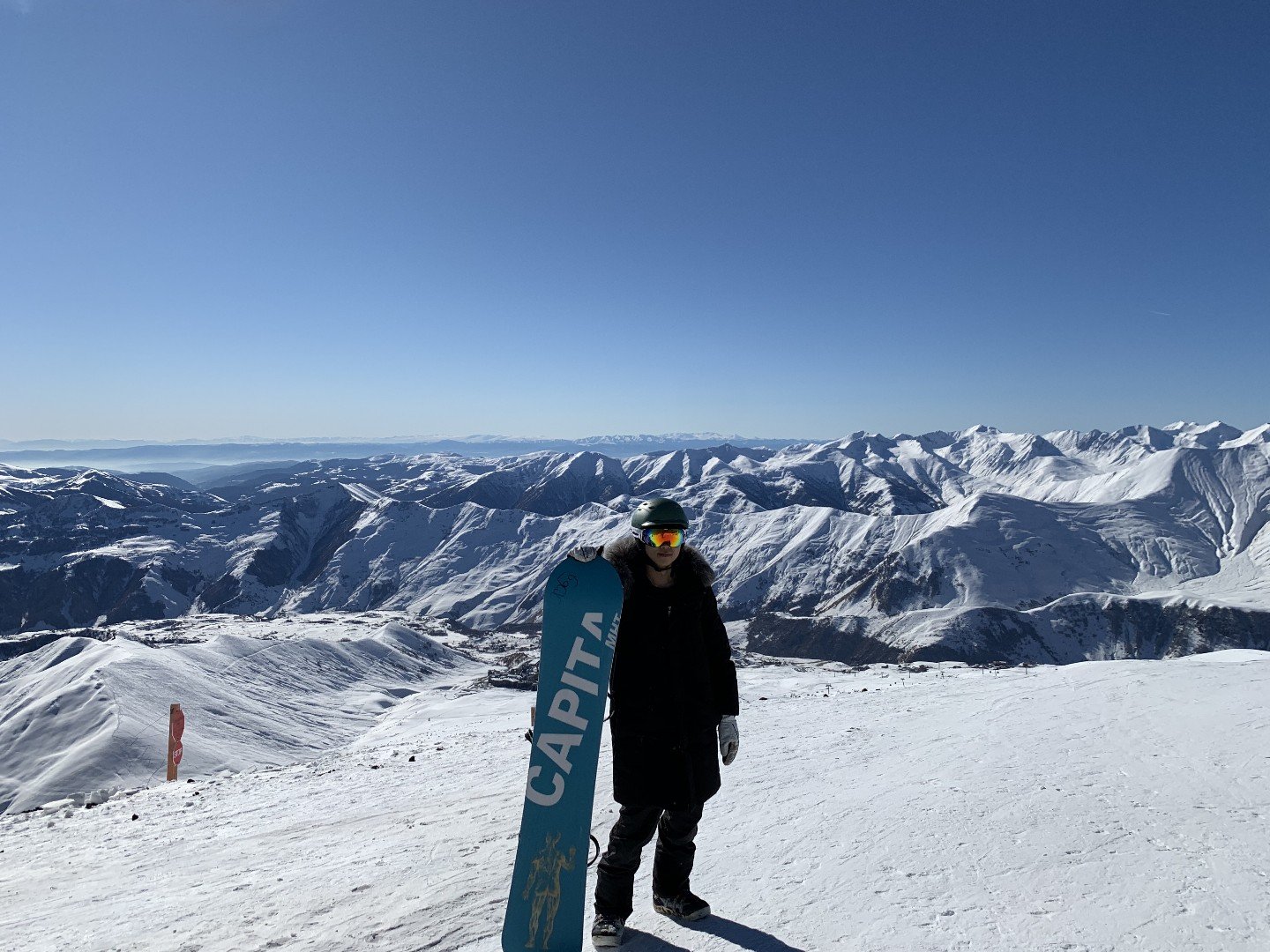 Ski resort slope with mountains in the background